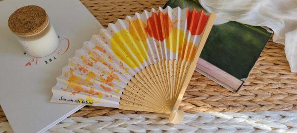 Éventail aux teintes chaudes jaune orangé