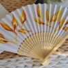Éventail au feuillage jaune orangé